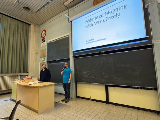 Speaker, Moderator and the first slide, university class room 