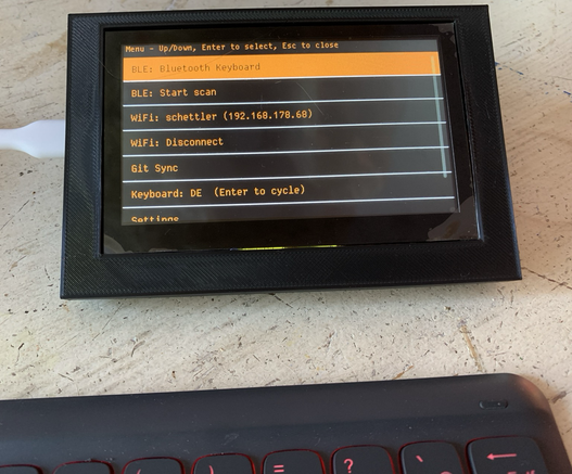 WriterDeck, using the opensource Draftling software, using the amber-on-black colour scheme 